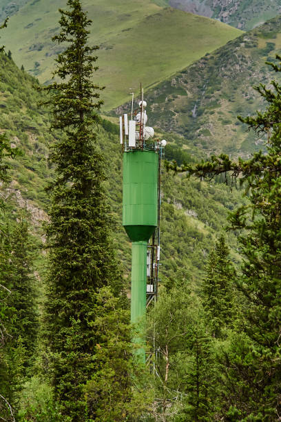 istock cellular antennas on a tower in the mountains 1129854941