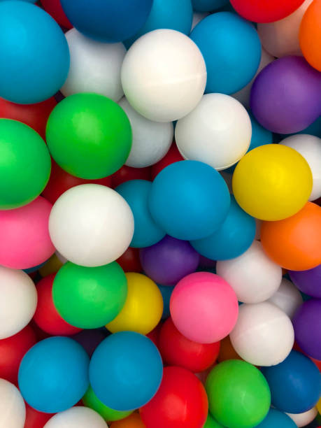 istock Top view colorful plastic balls in a kid playground pool. 1129854977