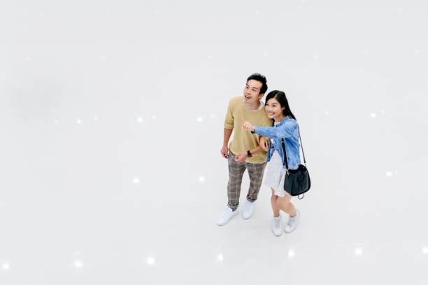 istock Chinese couple on bright floor in mall 1129855242