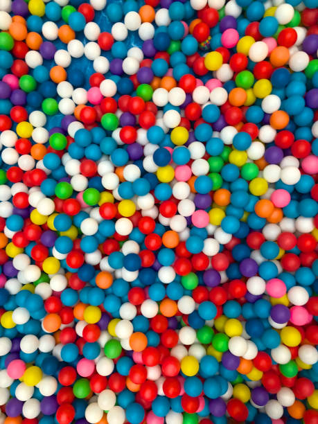 istock Top view colorful plastic balls in a kid playground pool. 1129855385