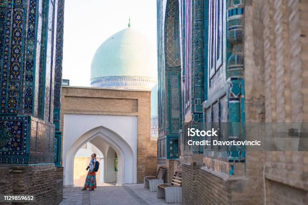 Senior Woman At Memorial Buildings Of Shahizinda Mausoleums In Samarkand Uzbekistan Stock Photo - Download Image Now