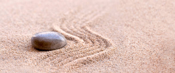 istock Zen stone and sand, panoramic zen still life 1129860306