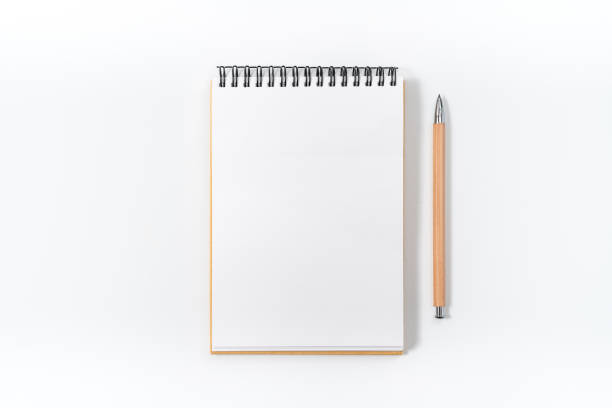 istock Brown spiral notebook isolated on white background.top view 1129864722