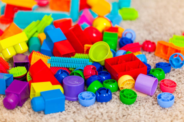 istock Toys big blocks different colors on carpet 1129865975