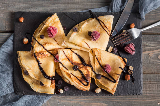 istock Sweet crepes wrapped with fresh berries 1129870615