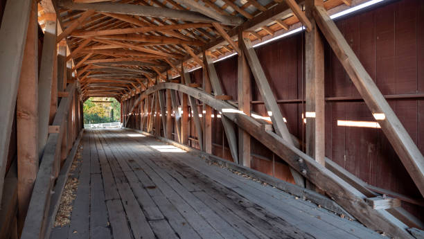 istock Interior of Covered Bridge with Burr Arch Trusses 1129871685