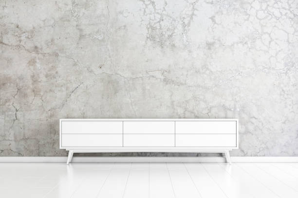 istock White wooden tv console mockup near concrete wall 1129873464