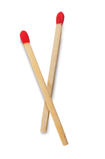 Studio shot of a single unlit match cut out against a white background