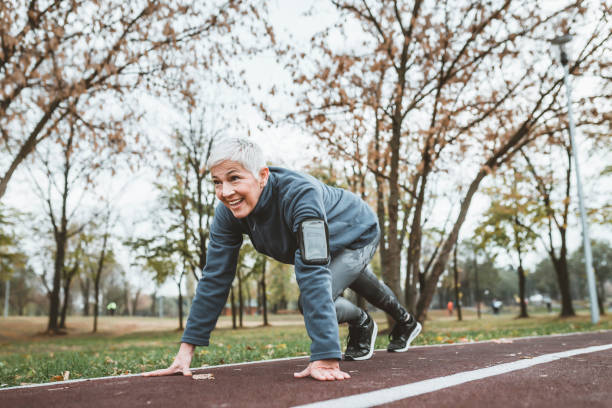 istock Mature Woman Preparing for Workout 1129877382