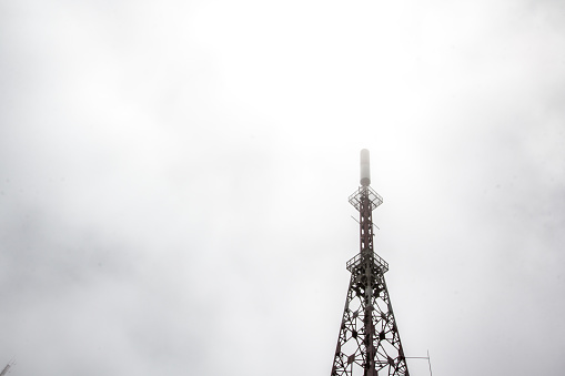 Radio tower in Ponta Delgada, azory islands, covered in white mist