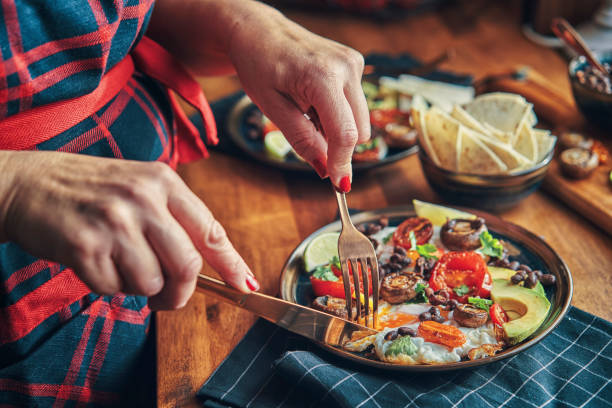 istock Mexican Style Breakfast with Eggs, Mushrooms, Beans, Tomatoes, Avocado and Tortilla 1129879834
