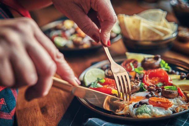 istock Mexican Style Breakfast with Eggs, Mushrooms, Beans, Tomatoes, Avocado and Tortilla 1129879835