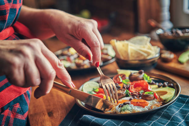 istock Mexican Style Breakfast with Eggs, Mushrooms, Beans, Tomatoes, Avocado and Tortilla 1129879836