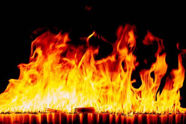 istock Firestorm texture on black background, shot of flying fire sparks 1129884835