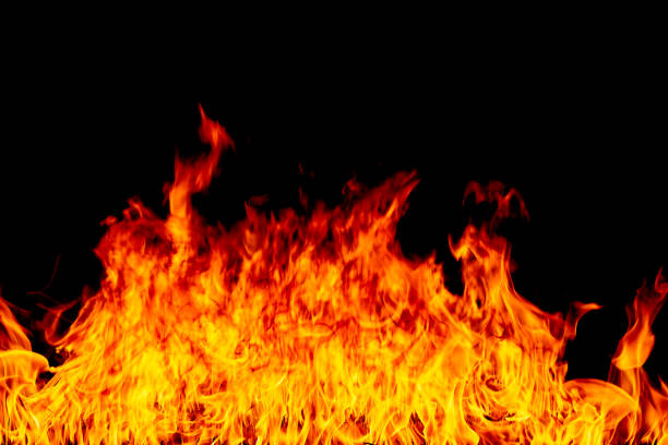 istock Firestorm texture on black background, shot of flying fire sparks 1129884864