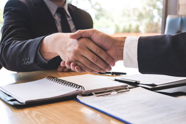 istock Successful job interview with boss and employee shaking hands after negotiation or interview, career and placement concept 1129885210