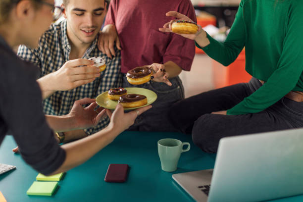 istock International design team having a brake 1129886065