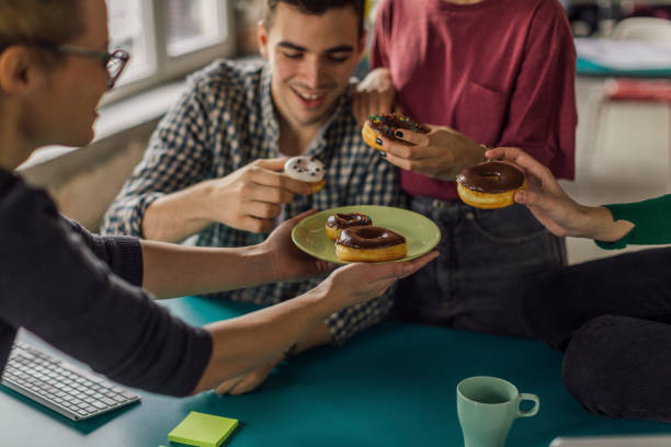 istock International design team having a brake 1129886070