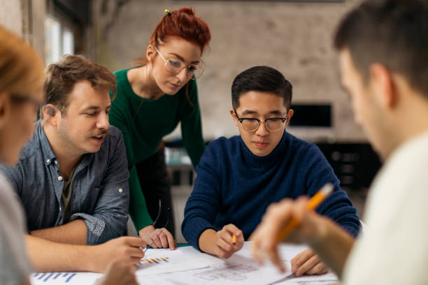 istock Team of architects on a meeting 1129886125