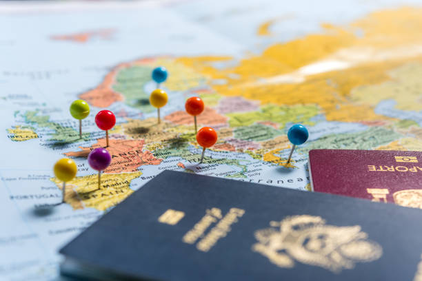 Planning Holidays Maps with pins and passports, planning the holidays. citizenship stock pictures, royalty-free photos & images