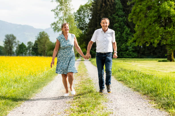 istock Senior couple walking together 1129894016