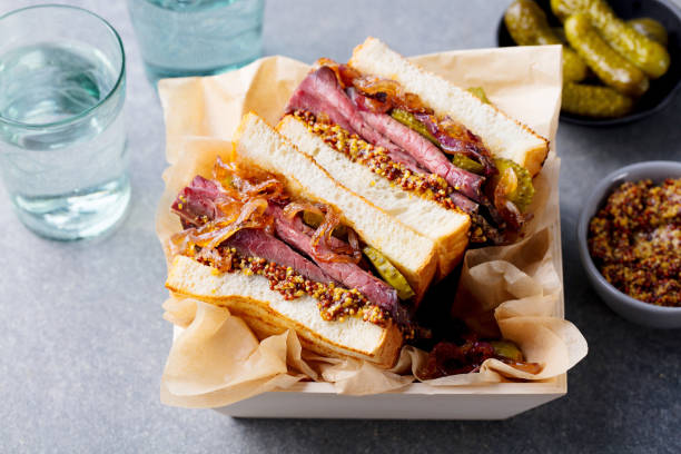Sandwich with roast beef in wooden box. Top view. Close up. Sandwich with roast beef in wooden box. Top view. Close up pastrami photos stock pictures, royalty-free photos & images