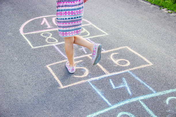istock street children's games in classics. Selective focus. 1129898616