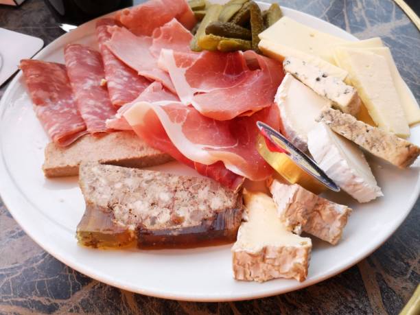 Charcuterie, cold cuts, appetizer plate in a Paris bistro