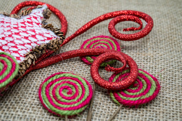 istock Fabric and glittery Christmas holiday elements sitting on a burlap background 1129899102