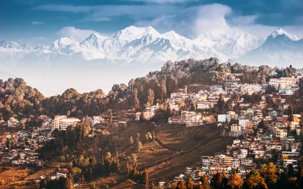 Darjeeling and Kangchenjunga on the background. Kanchenjunga, is the third highest mountain in the world. Beautiful Himalayan landscape near Nepal and Sikkim. Indian Himalayas.