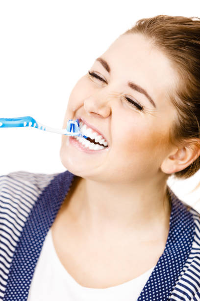 istock Woman brushing cleaning teeth. 1129900173