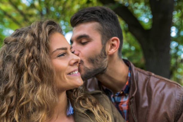 istock Handsome man is in love with his attractive girlfriend 1129900589