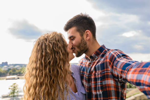Young handsome couple showing sweetest emotions stock photo