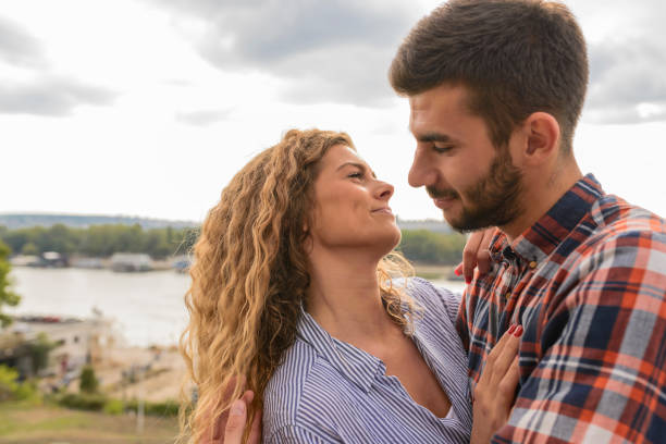 istock Attractive long haired woman showing love emotions 1129900771