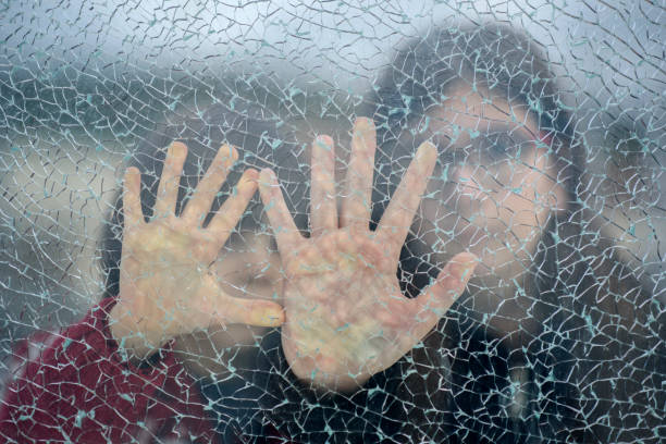 defensa personal - broken window glass women fotografías e imágenes de stock