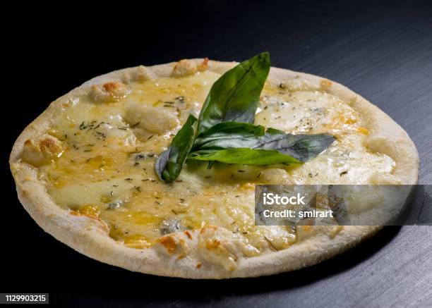 Fresh Italian Pizza On Black Background Stock Photo - Download Image Now - Four Objects, Pizza Margherita, Pizza