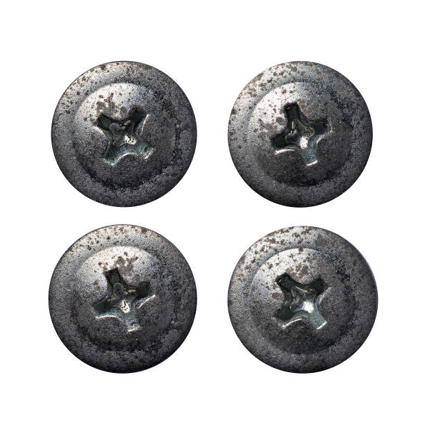 istock Old rusty metallic rivet or screw heads 1129904622
