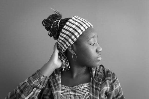 Portrait of Black Teenager Girl Studio shot moment sad 15 years old girl stock pictures, royalty-free photos & images