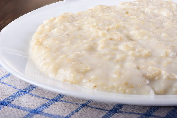 istock Healthy oatmeal closeup on a white plate 1129906213