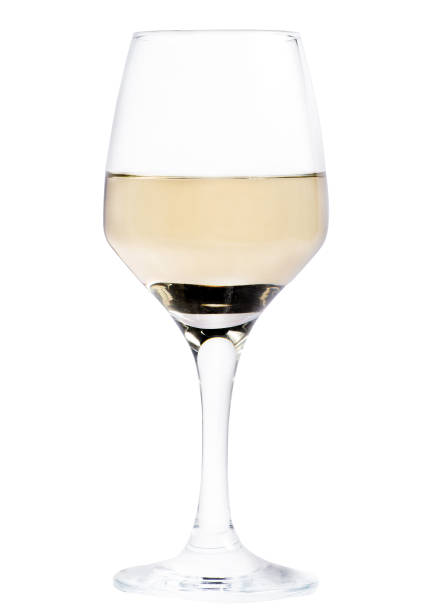 istock glass of wine on a white background. Half a glass. Isolate. Half empty glass 1129906459