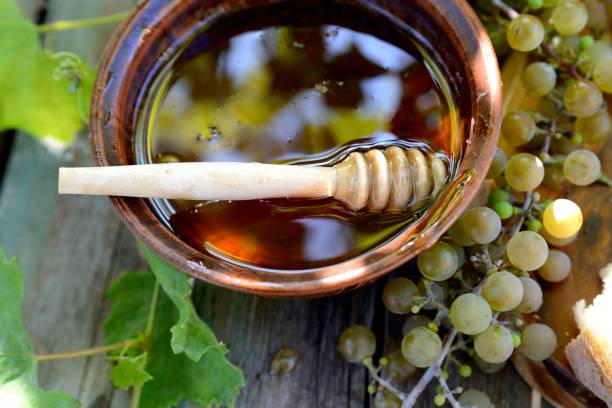 istock Still life with honey, grapes and white bread 1129909050