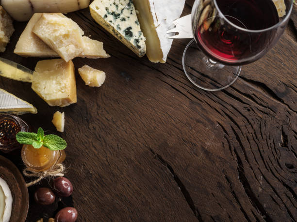 istock Cheese platter with organic cheeses, fruits, nuts and wine. 1129909769