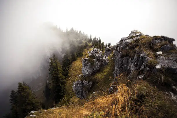 Mountain Breitenstein in foggy autumn