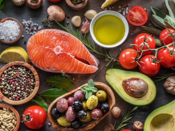 istock Raw salmon with spices and vegetables. 1129915880