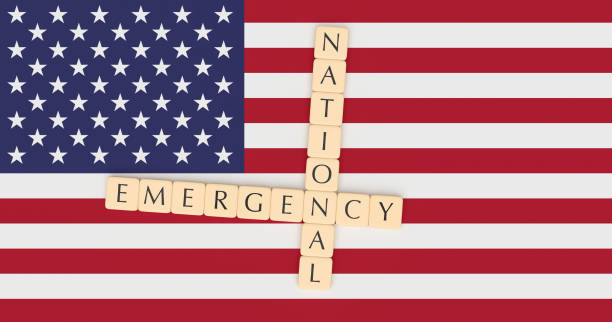 istock Letter Tiles National Emergency On US Flag, 3d illustration 1129917123