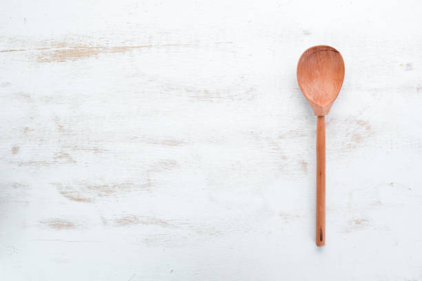 istock A wooden spoon on the old background. Top view. Free copy space. 1129926297