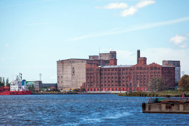 istock huge old warehouse in the port 1129928989