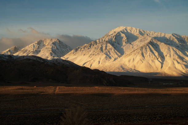 istock snowy mountain peaks, hills, desert valley landscape 1129929094