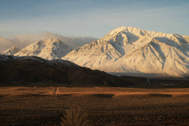 istock snowy mountain peaks, hills, desert valley landscape 1129929099
