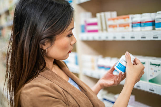 istock Woman shopping at pharmacy 1129931076